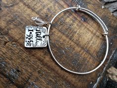 Handstamped pewter charm on bangle bracelet. Silver Nickel-free Bangle For Friendship, Nickel-free Bangle Charm Bracelet For Personalized Gift, Nickel Free Charm Bangle For Personalized Gift, Hand Stamped Silver Metal Bracelets, Adjustable Hand Stamped Silver Charm Bracelet, Medical Id Bracelets, Still I Rise, Necklace Quotes, Small Pillows