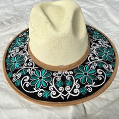 Shop freetobezoe's closet or find the perfect look from millions of stylists. Fast shipping and buyer protection. This hat is truly a work of art. Brand new. Never worn. Elastic band inside. Pretty flexible fit. White Bohemian Sun Hat One Size, White Bohemian Sun Hat, Handmade White Bucket Hat, White Bohemian Panama Hat With Flat Brim, Summer Embroidered Hat With Curved Brim, Summer Sun Hat With Embroidered Curved Brim, Bohemian Style White Straw Hat With Curved Brim, Bohemian White Straw Hat With Curved Brim, White Bohemian Sun Hat With Flat Brim