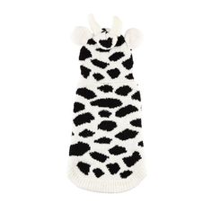 a black and white animal print knitted dog sweater with pom - poms