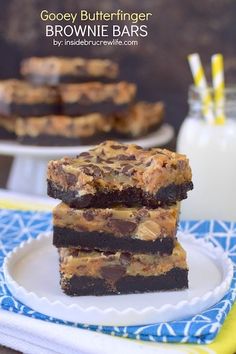 gooey butterfingered brownie bars stacked on top of each other