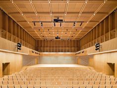 an empty concert hall with rows of seats