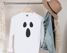 Halloween is here! Its time to get SPOOKY This Ghost Face Fall Crew Neck Sweater is the perfect sweatshirt to throw over a pair of jeans or a maxi skirt with some sneakers. We are loving this Ghostface Sweater ♥ Perfect sweater to venture off to the haunted house or ghost walk tour! This Ghost Face Sweater comes in Black or White (other colours available upon request) with the graphic being white (on the black sweater) or black (on the white sweater) This sweater is a unisex crew and fits big - Fun White Hoodie For Fall, I See Ghosts Sweatshirt Outfit, Ghost Hoodie, Embroidered Ghost Sweatshirt, Sweatshirt Design Ideas, Lonely Ghost Sweatshirt, Ghost Sweatshirt, Ghost Walk, Ghost Faces