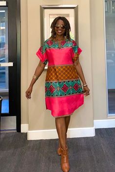 "Cute Ankara dress made from Authentic African print fabric. A statement dress, bold, vibrant and colorful. A simple elegant style, easy to wear, and yet sophisticated. Length 39\" *️⃣ FEATURES 🔸2 side Pockets 🔸Fun split neck 🔸Relaxed fit 🔸Model is 5'7\" MEASUREMENT GUIDE: We appreciate including your bust, waist, and hip measurements at checkout otherwise, we will use the measurements listed with the size you selected. US \"2\" /UK \"6\" XXS Bust:31 Hips: 34 US \"4\"/ UK \"8\" XS - Bust:32 Ankara Midi Dress, African Shirt Dress, Simple Elegant Style, Ankara Clothing, Midi Dress With Pockets, Dress Ankara, African Print Dress Ankara, Lace Dress Styles, Pink Summer Dress