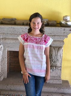 Beautiful traditional Mexican blouse made on a pedal loom with floral motifs, hand-embroidered in bright thread. These blouses have a unique embroidery so it can vary. Mexican textile art has centuries of history and creativity throughout the country. Mexico is recognized as one of the leading countries with a beautiful artistic production in the textile world, miraculous hands of talented artisans from different states of the country create stunning embroidery clothing, and various items. #Oaxa Spring Folk Blouse With Woven Motifs, Bohemian Blouse With Woven Motifs, White Tops With Resham Embroidery For Festivals, White Resham Embroidery Top For Festivals, Folk Style Embroidered Top With Woven Motifs, Traditional White Peasant Top With Intricate Embroidery, Folk Style Peasant Top With Embroidered Border, Folk Style Short Sleeve Peasant Top With Embroidered Border, Spring Short Sleeve Blouse With Resham Embroidery