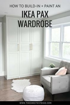 a living room filled with furniture and white cupboards next to a large window on top of a hard wood floor