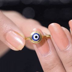 Product Details Turn the blind eye with our Evil Eye Enamel Coated Ring adorned in Solid Gold. Product Information SKU SHP-RINGS122041834 Width 7.5 mm Height 4.4 mm Weight 1.68 gm (Approximate) View More Product Parent Collection Handle evil-eye-jewelry 14k Gold Evil Eye Ring, Blue Evil Eye Round Ring, Blue Evil Eye Ring Jewelry, 14k Gold Evil Eye Amulet Jewelry, Evil Eye Enamel Jewelry Gift, Ring Sizer, Signature Jewelry, 18k Yellow Gold Ring, Timeless Jewelry