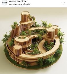 an architectural model of a building surrounded by greenery and palm trees is shown in the foreground