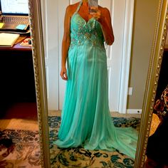 Beautiful Flowing Halter Macduggal Giwn. A Few Loose Beefs But All Are There Green Gown For Prom Season And Pageants, Green Gown For Pageant And Prom Season, Green Embellished Gown For Pageant, Embellished Green Gown For Pageant, Embellished Green Gown For Pageants, Glamorous Green Gown For Homecoming, Embellished Gown For Homecoming And Prom, Floor-length Embellished Gown For Homecoming, Green Floor-length Gown For Homecoming