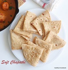 tortilla chips on a plate next to a pot of sauce