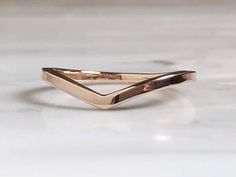 a gold ring sitting on top of a white counter