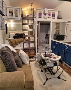 a living room filled with furniture and a ladder