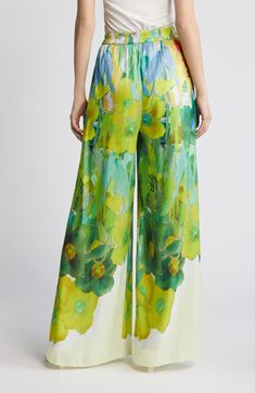 Vibrant watercolor blooms embolden these polished pants punctuated with flowy wide legs. 100% polyester Dry clean Imported Spring Green Wide Leg Pants With Floral Print, Green Silk Bottoms For Spring, Elegant Printed Spring Bottoms, Spring Green Floral Print Wide Leg Pants, Summer Wide Leg Silk Pants, Elegant Floral Print Wide Leg Pants For Spring, Elegant Wide Leg Pants With Floral Print For Spring, Wide Leg Silk Pants For Summer, Green Silk Bottoms For Summer