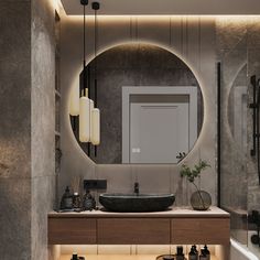 a bathroom with a round mirror above the sink and lights on the wall behind it