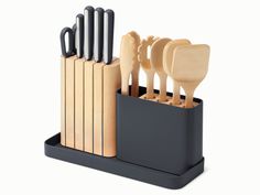 an assortment of kitchen utensils in a holder