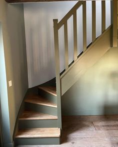 an empty room with stairs leading up to the second floor