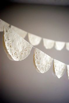 white lace bunting hanging from the ceiling