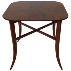 a small wooden table with two legs and a triangle shaped design on the top, against a white background