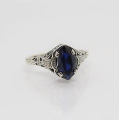 Sterling Silver Blue Sapphire Filigree Ring ....Marked 925...Total of weights 2.1grams..Size 10...Measure of Face 10.1MM...It's in very good condition. Mens Blue Topaz Rings, Sapphire Engagement Ring Men, Vintage Blue Sapphire Promise Ring, Vintage Blue Oval Sapphire Ring, Classic Sapphire Ring Collectible, Classic Sapphire Rings For Collectors, Anniversary Blue Sapphire Ring Stamped 925, Blue Sterling Silver Filigree Ring, Blue Filigree Ring In Sterling Silver