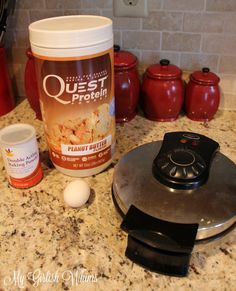 ingredients to make peanut butter frosting sitting on a counter top next to a blender