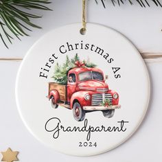 a christmas ornament with an old red truck carrying a tree