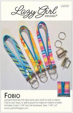 four lanyards with different colors and patterns on them, one has a keychain