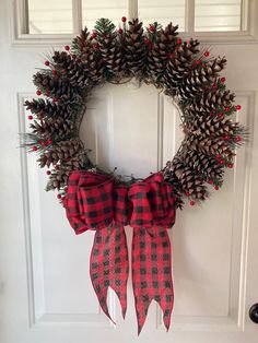 Handmade pine cone wreath. From barn door to front door it perfect for any farmhouse decor!  Item in photo is 20 x 20 Pine Cone Wreath, Cone Wreath, Pinecone Wreath, Wreaths Diy, Farm Stand, Christmas Wreaths Diy, Pine Cone, Door Wreath Hanger, Diy Wreath