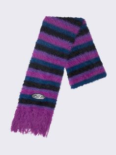 Wrap yourself in style with our Striped Tassel Furry Scarf! In black, blue, and pink, this scarf blends Y2K vibes with grunge. For more alt accessories, shop now at Minga London! Alt Accessories, Fluffy Scarf, Minga London, Striped Scarf, Y2k Vibes, Crop Top Sweatshirt, Striped Scarves, Blue And Pink, Graphic Tee Shirts