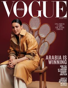 a woman sitting on top of a chair in front of a magazine cover with tennis rackets