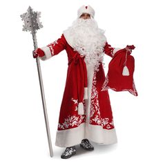 a man dressed as santa claus holding a bag and a stick in one hand while standing next to him