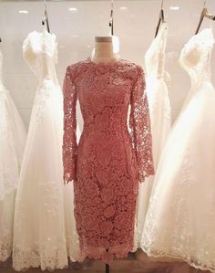 dresses on display in a store window with the words l & p dress studio written above them