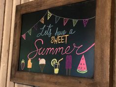 a chalkboard sign that says let's have a sweet summer with ice cream and watermelon