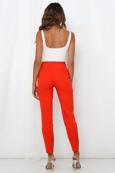 Length: Inside Leg: 71cm; Front Rise: 27cm; Leg Cuff: 28cm (of size 6) Tangerine pants.  Non-lined. Cold hand wash only.  Model is a standard XS and is wearing size 6.  True to size. Mid-weight woven fabric; non-stretchy.  Belt-loops.  Polished gold-button shank and concealed zip fly.  Twin fauxwelt pockets to rear.  Polyester/Elastane. Reach your new season's fashion goals in brightly coloured hues and don the I'll Take You There Pants from MOSSMAN. Feminine, sophisticated and chic, the timeless pants feature a classic belted waistband, a concealed zip fly with a polished gold-button detailing with faux welt pockets to the rear. Its high-waisted silhouette does everything to flatter the figure! Team with metallic heels, the brand's coordinating I'll Take You There Blazer, and layer the Lo Fashion Goals, Metallic Heels, Leg Cuffs, Gold Buttons, Parachute Pants, Woven Fabric, Hand Wash, High Waisted, Size 6