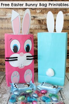 two paper bags with bunny ears on them and candy in the bag next to it