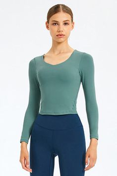 Sizing: Slim fit Pattern: Solid Features: Long sleeve. removable bra pads. fitness wear Necline: Round neck Sheer: No Stretch: Highly stretchy Product measurements: 4: length 17 in. bust 28 in. hem 26 in. sleeve 21 in6: length 18 in. bust 30 in. hem 27 in. sleeve 22 in8: length 18 in. bust 31 in. hem 29 in. sleeve 22 in10: length 19 in. bust 33 in. hem 30 in. sleeve 22 in12: length 19 in. bust 35 in. hem 32 in. sleeve 23 in Material composition: 80% nylon. 20% spandex Care: Machine wash cold... Sports Tops With Built-in Bra, Fitted Sports Top With Built-in Bra, Yoga Tops With Built-in Bra And Compression, Stretch V-neck Crop Top For Workout, Gym Tops With Built-in Bra, Fitted V-neck Top With Medium Bust Support, Fitted Activewear With Built-in Bra For Pilates, Fitted V-neck Crop Top For Workout, Seamless Long Sleeve Athleisure Tops