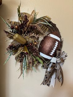 a football wreath is hanging on the wall