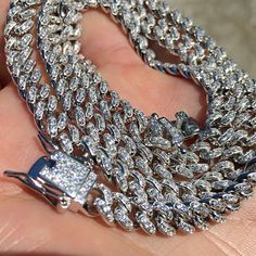 Shine bright like a diamond with this Mens Real 925 Sterling Silver Iced Cuban Hip Hop Chain Bling Out CZ. Handmade in Italy with Micro Pave Setting Style, this 6MM thick chain is perfect for all hip-hop lovers. Get yours now in 16"-24" length. #HipHopJewelry #Necklaces #CubanChain #HipHopChains #SilverChain #MensNecklace # 🤩💎🔥 Silver Cuban Link Jewelry With Rhinestones, Silver Diamond Chain Necklace With Bling, Silver Cuban Link Bling Necklace, Silver Crystal Cuban Link Necklace, Silver Cubic Zirconia Necklace With Bling, Sterling Silver Cuban Link Necklace With Bling, Silver Cuban Link Chain Necklace With Crystal, Silver Crystal Cuban Link Chain Necklace, White Gold Bling Round Necklace