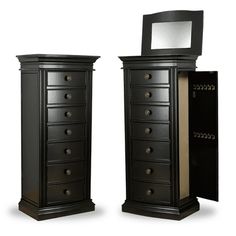 two tall black dressers with mirrors on top of them and one is open to reveal a mirror