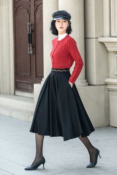 About this item: This black circle skirt has an embroidered design on the waist. The exquisite midi black wool skirt is tailored to perfection, ensuring a snug yet elegant fit that exudes sophistication and style.  With its timeless silhouette and luxurious feel,  this bespoke womens pleated wool skirt is a true investment piece that will elevate any outfit to new levels of refinement and class. DETAIL * 30% wool, 30% fiber, 40% polyester * Fully satiny lining, more nice to the touch body * Two Winter Evening Knee-length Skirt, Knee-length Evening Skirt For Winter, Elegant Black A-line Pleated Skirt, Elegant Winter Pleated Flared Skirt, Black A-line Pleated Skirt For Fall, Black Pleated Full Skirt For Winter, Elegant Black Winter Skirt, Elegant Black Skirt For Winter, Custom Skirt