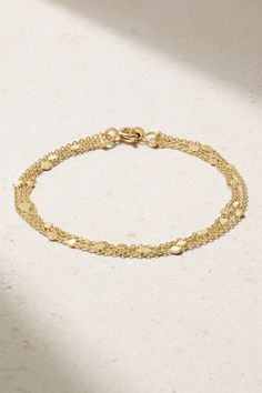 Sia Taylor likes to think of her collections as ‘miniature works of art’ – and we couldn’t agree more. This ‘Falling Dust’ bracelet is adorned with tiny gold dots, each one handmade by artisans in Taylor’s Somerset atelier. They’re scattered along three fine chains like petals caught up in a breeze. Formal Luxury Gold Bracelet With Delicate Chain, Luxury Bracelets With Delicate Chain, Luxury 14k Gold Bracelets With Delicate Chain, Luxury Gold Bracelet With Delicate Chain For Formal Occasions, Luxury Gold Bracelet With Delicate Chain For Formal Events, Luxury 14k Gold Bracelet With Delicate Chain, Elegant Hallmarked Sterling Silver Bracelet In Gold, Delicate Yellow Gold Chain Bracelet, Yellow Gold Delicate Chain Bracelet