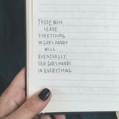 someone holding up a book with writing on it that says those who are everything in god's hands will eventually see god's hands in everything