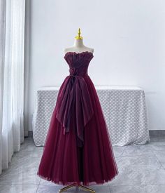 Burgundy+strapless+tulle+long+ball+gown Product+Code:+CT3616 Silhouette:+A-Line Material:+Tulle Waist:+Natural Back+Details:+Lace+Up Length:+Floor+Length Lining:+Fully+Lined Built-In+Bra:+Yes Size: Besides+stand+size+2-16,+we+still+offer+free+custom+size,+please+provide+the+follow... Formal Strapless Tulle Evening Dress, Strapless Tulle Evening Dress For Formal Occasion, Formal Strapless Evening Dress With Tulle Skirt, Strapless Tulle Skirt Evening Dress For Formal Events, Strapless Tulle Dress For Banquet, Strapless Tulle Dress With Sweep Train, Strapless Tulle Dress With Fitted Bodice For Banquet, Strapless Tulle Evening Dress For Banquet, Strapless Tulle Gown For Gala