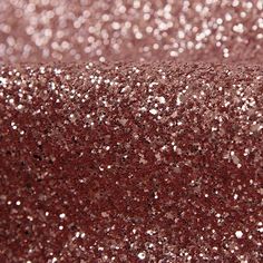 pink glitter fabric with small white dots on the top and bottom, as well as dark red