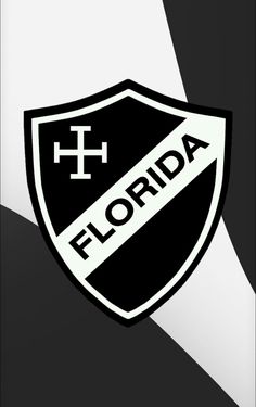 a black and white photo with the word florida on it's side, in front of a shield