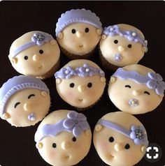 six cupcakes are arranged in the shape of babies