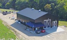 an aerial view of a barn in the country