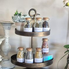 three tiered tray with spices and herbs on it