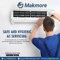 a man fixing an air conditioner in front of a sign that says makmore safe and hygienic ac servicing