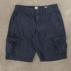 Women's Vintage Gap Cargo Shorts  + Closure: Zip  + Colour: Navy Blue  + Size Label States: W28  + Actual measurements (inches): W28  + Measurements (Inches): Hem = 9.5, Rise = 9.5  Please note that all vintage items have been previously worn, and may show some signs of previous wear. However, any significant damage will be photographed and/or stated in the items listing. Please note that damage to the inside may not always be photographed or listed. Blue Cargo Pocket Shorts, Blue Cotton Pants With Built-in Shorts, Blue Shorts With Side Pockets, Fitted Cotton Cargo Shorts With Pockets, Blue Cotton Cargo Shorts, Denim Blue Cotton Shorts With Pockets, Blue Short Bottoms With Patch Pockets, Denim Blue Cotton Shorts With Patch Pockets, Casual Navy Bottoms With Patch Pockets