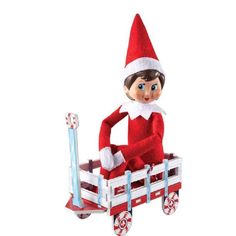 an elf sitting on top of a wooden wagon