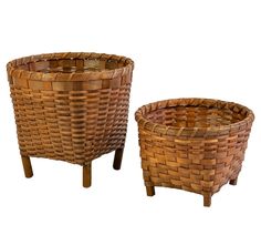 two woven baskets sitting next to each other